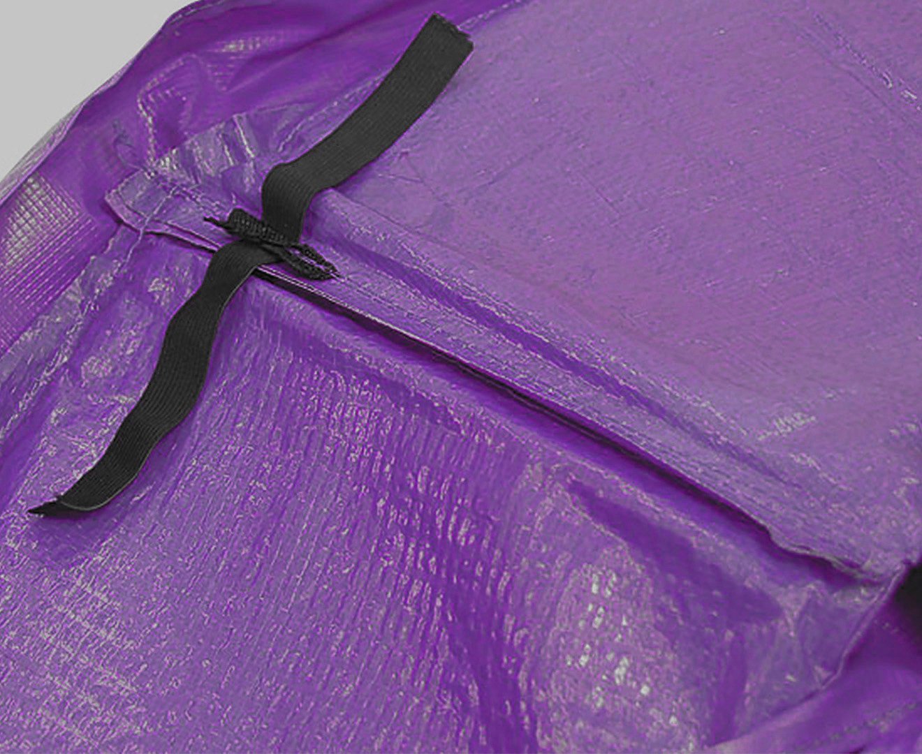 Purple trampoline replacement pad with black drawstring tie strap