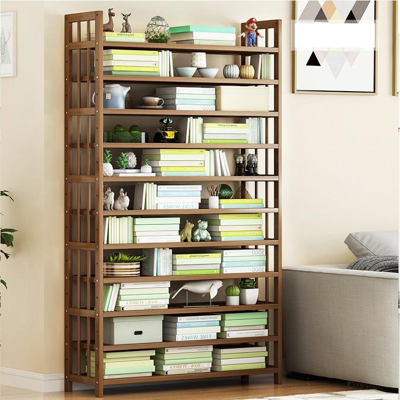 Bamboo corner shelving unit with open shelves, styled with shoes, books, and storage bins