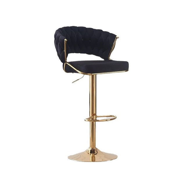 Black velvet barstool with padded round back, upholstered seat, and gold round base
