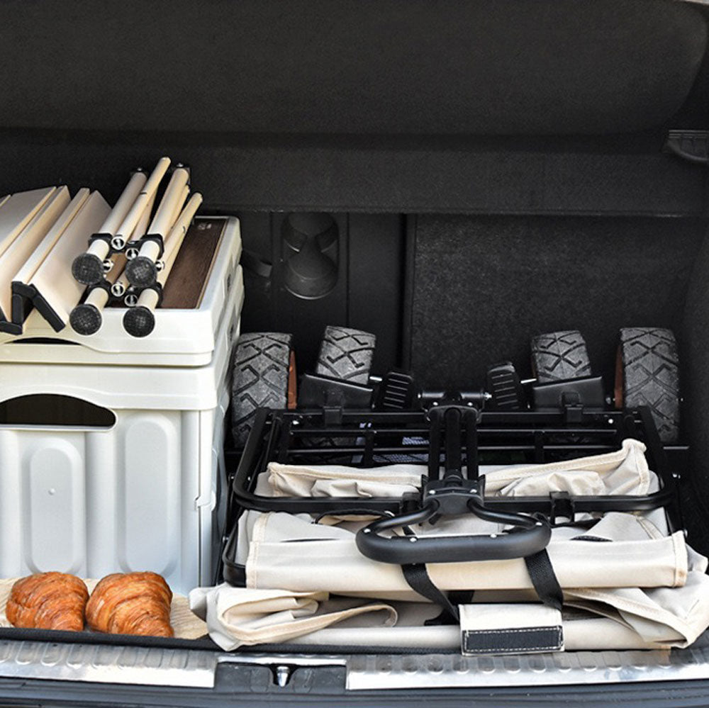 Folding wagon bed with black cross-brace frame and securing straps