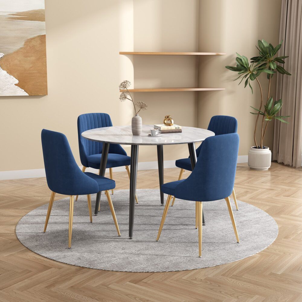 Round MDF marbling dining table with white-gray marble-effect top and slender black legs