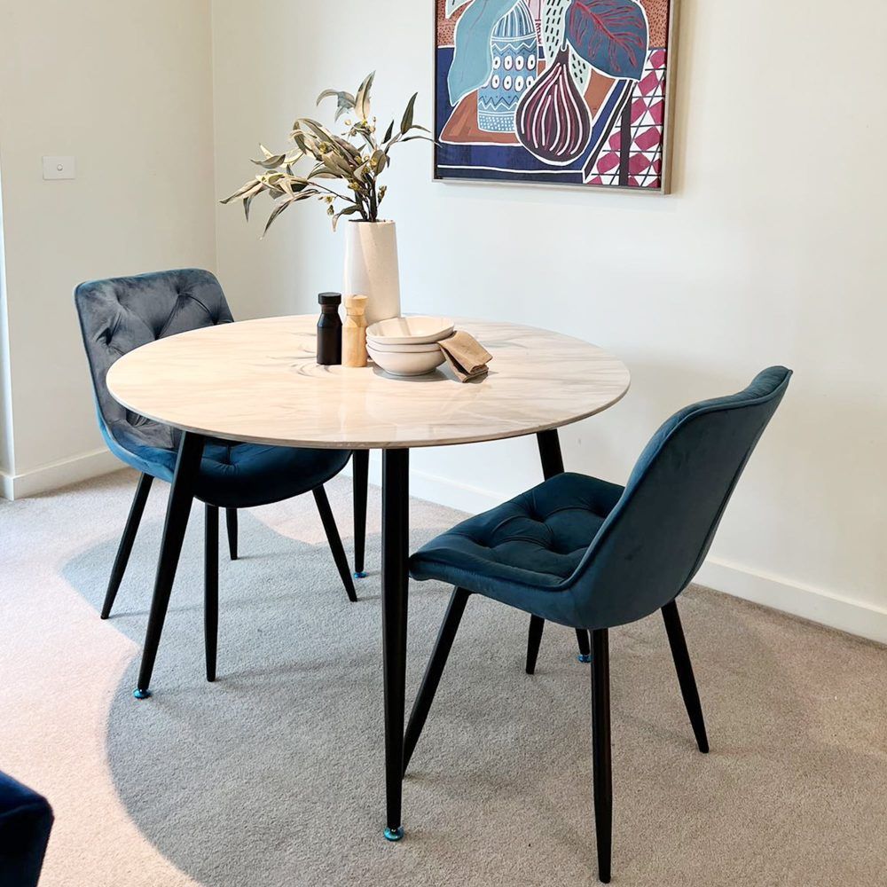 Round MDF marbling dining table with round white-gray top and black legs
