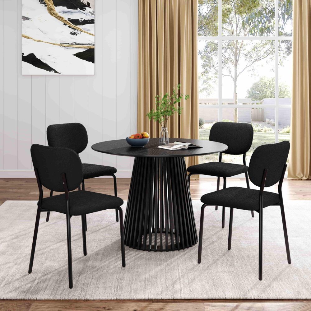 Round dining table with dark tabletop and ribbed slat pedestal base