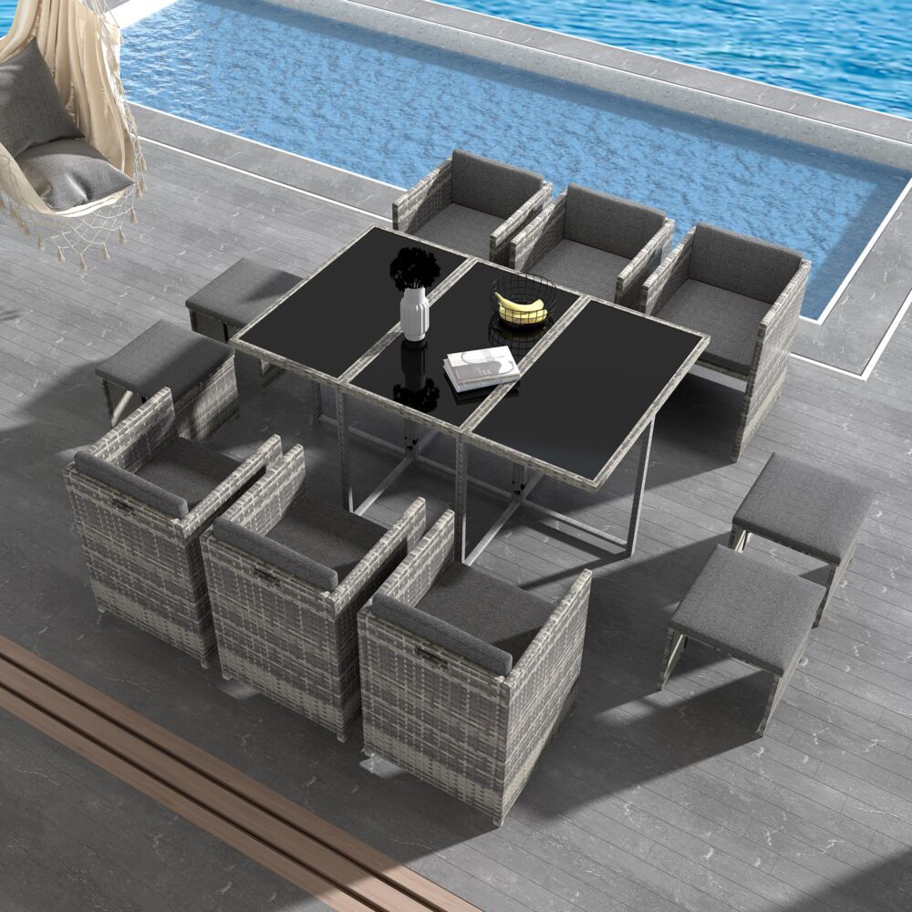 Grey outdoor dining set top view with glass-top table, benches, and padded ottomans