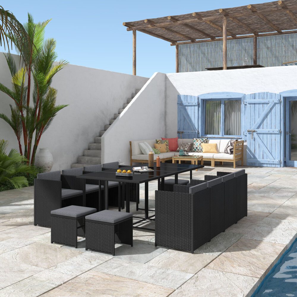Modular black outdoor dining set with glass tabletop, woven seats, and cushioned ottomans