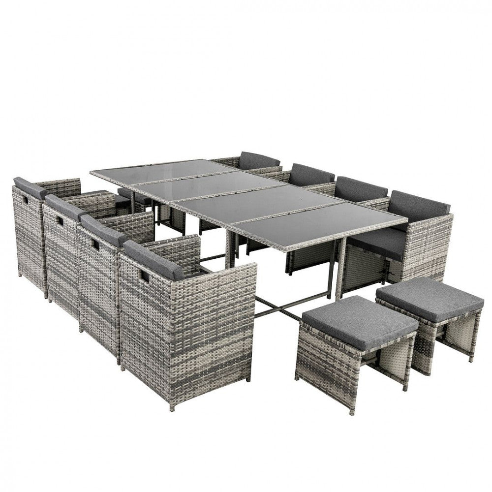 Grey outdoor dining set with rectangular table and corner seating with ottomans