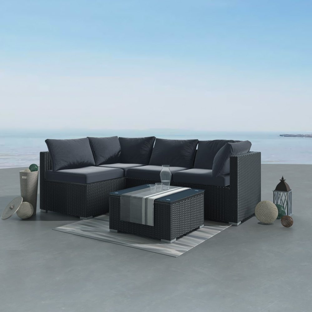Outdoor modular lounge sofa set with black woven frame and dark gray cushions, corner layout