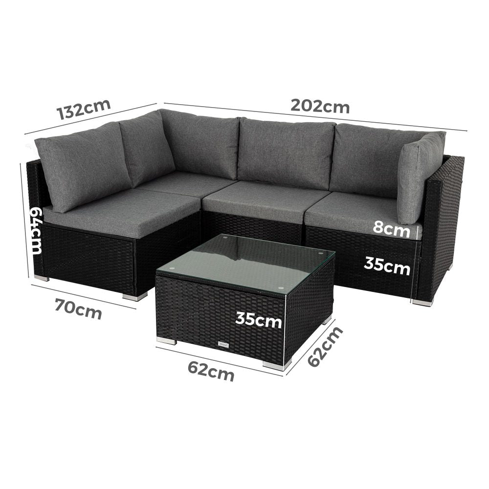 Modular sectional sofa with black woven modules, gray cushions, and square glass coffee table