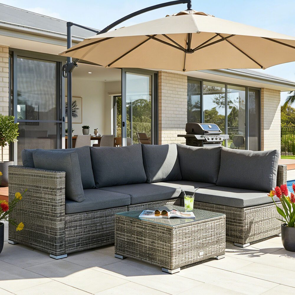 Grey outdoor modular lounge sofa with tufted cushions and chaise-style corner seat