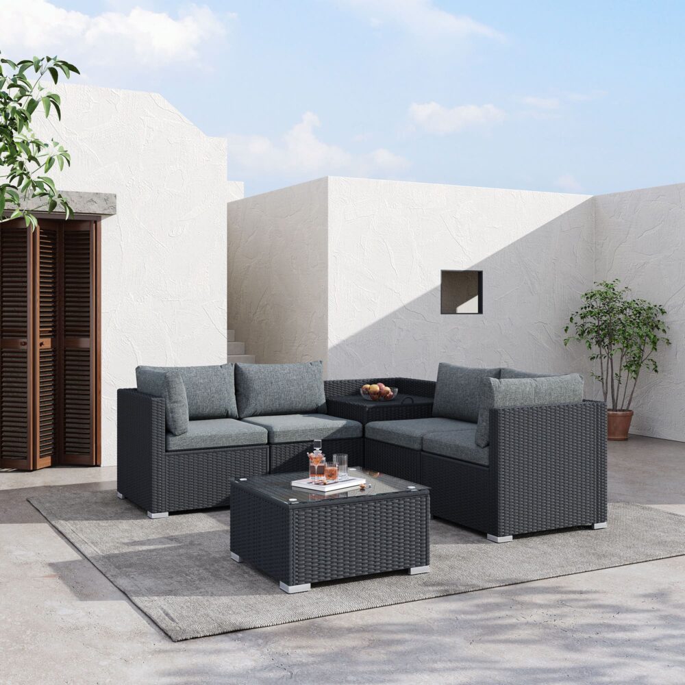 Outdoor modular lounge sofa set with dark woven arms and gray cushions, square ottoman-style table