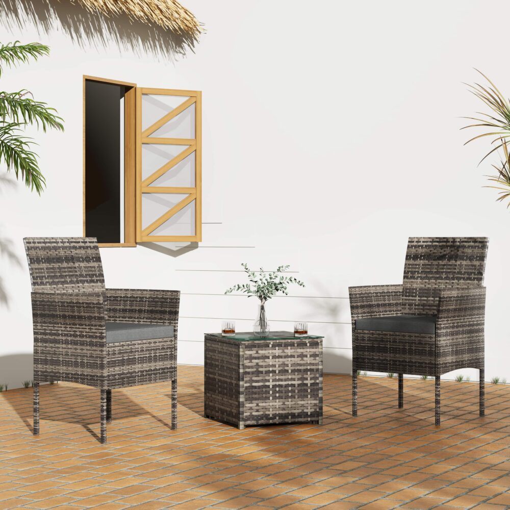 Grey PE rattan armchairs and square coffee table with dark cushions outdoors