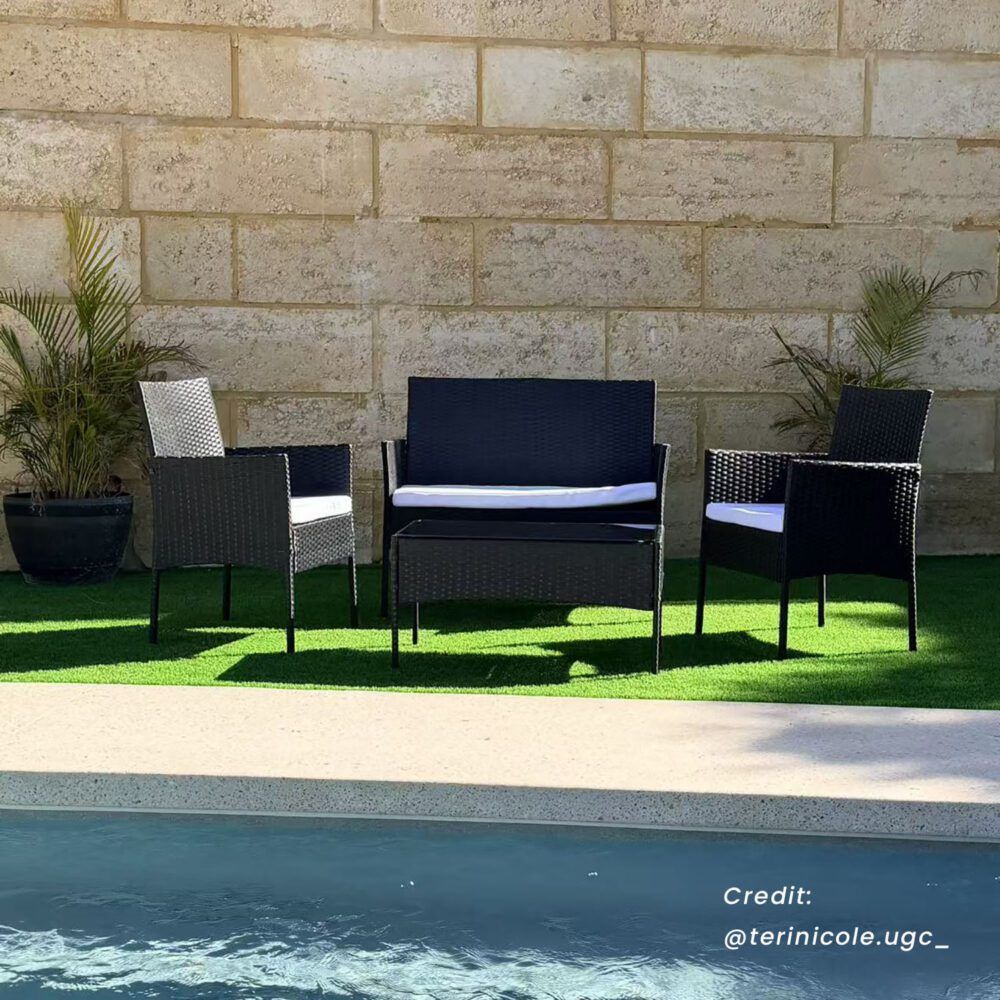 Dark wicker outdoor lounge sofa set with loveseat, armchairs, and glass-top table