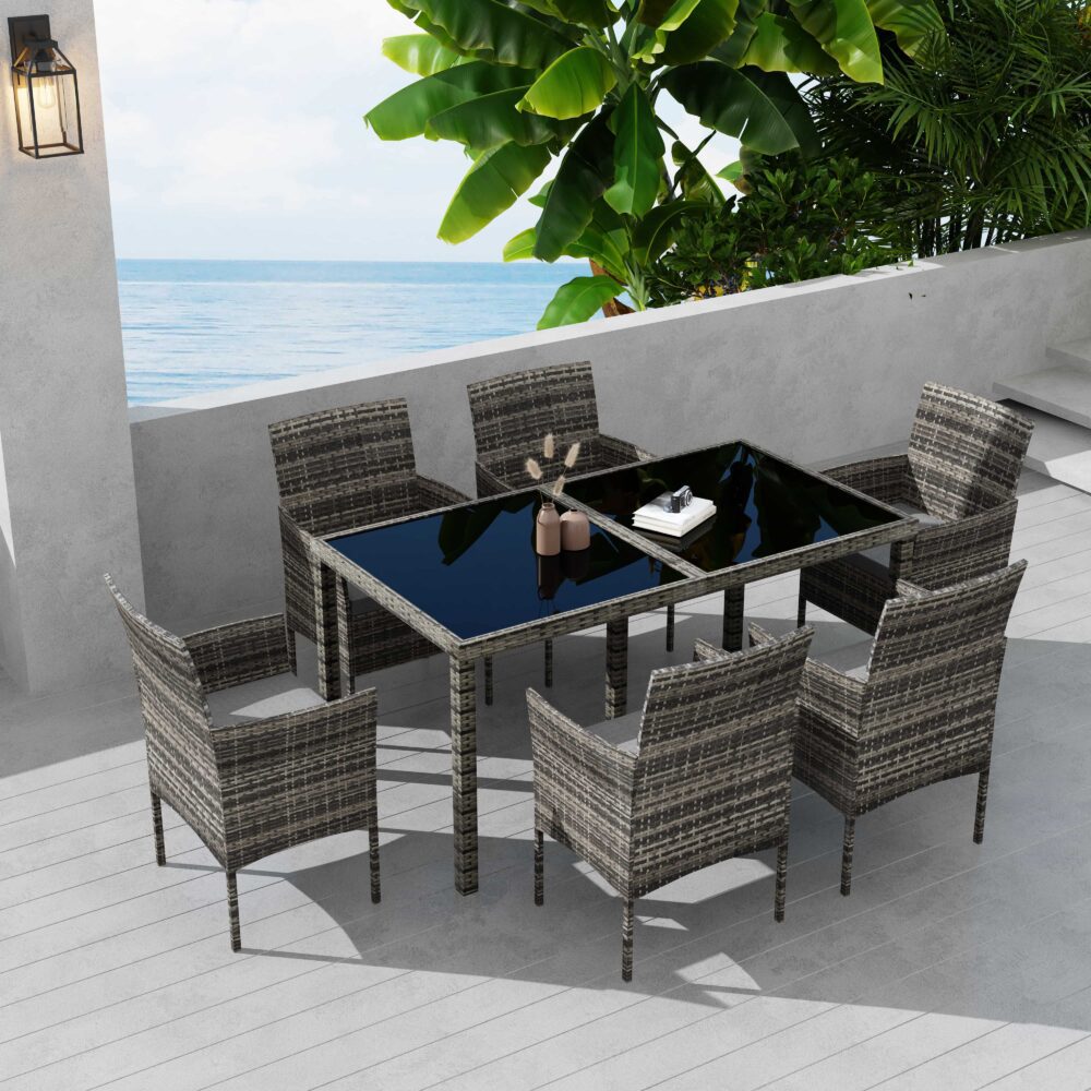 Grey wicker outdoor dining set with dark table insert and six cushioned chairs