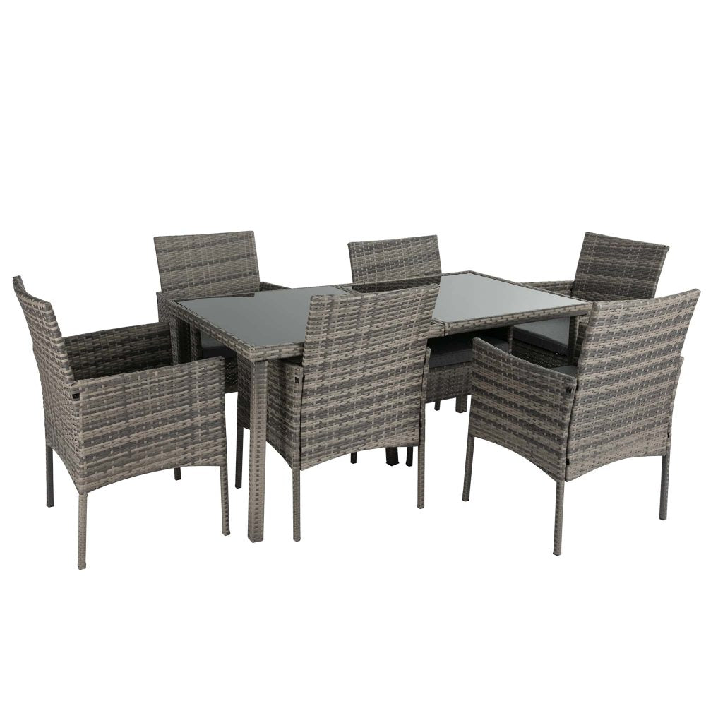 Grey wicker outdoor dining set with rectangular table and six chairs, angled view