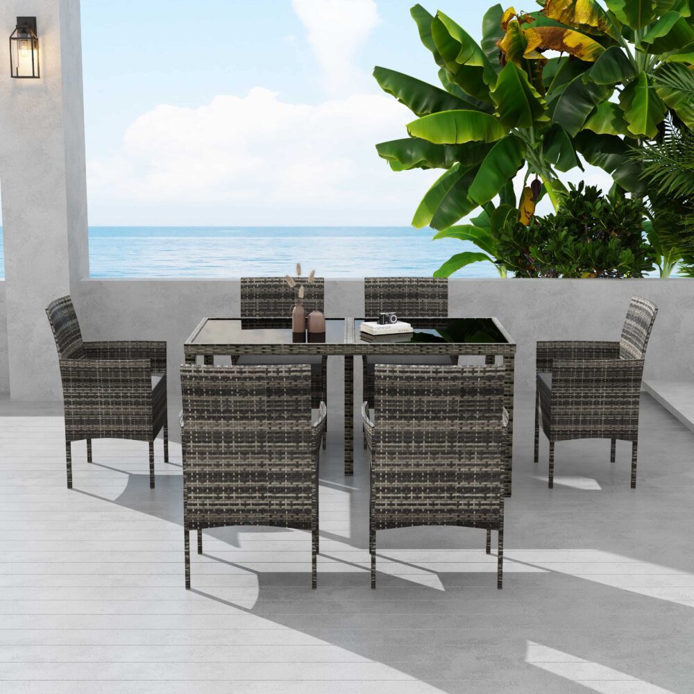 Grey wicker outdoor dining set with dark tabletop and six chairs, front view