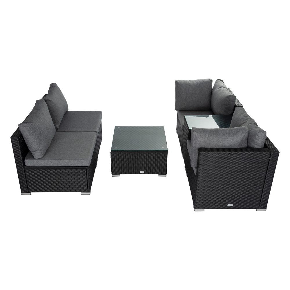 Wicker lounge seating set with gray cushions: two chairs and a square ottoman coffee table