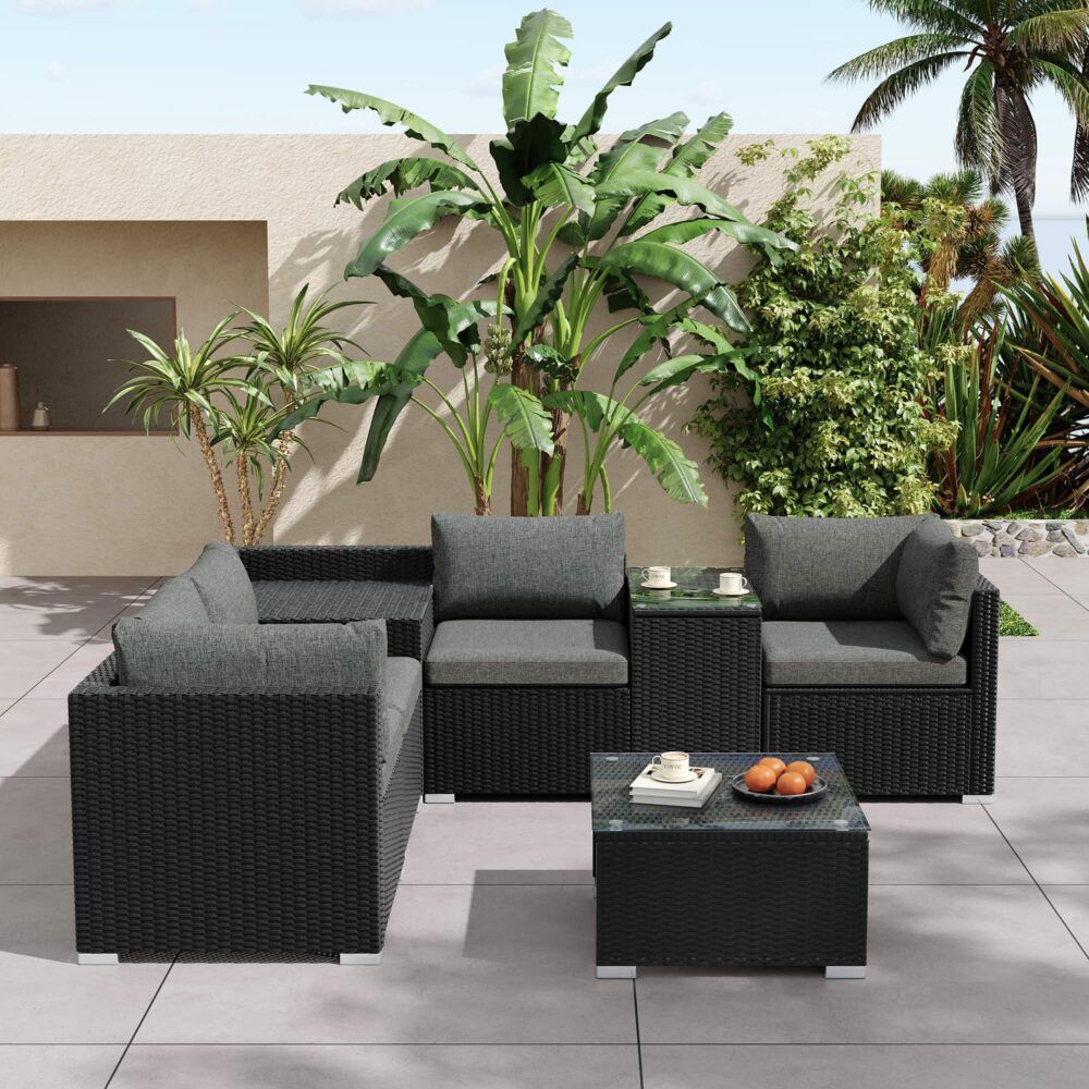 Black wicker outdoor sectional with grey cushions and square storage coffee table