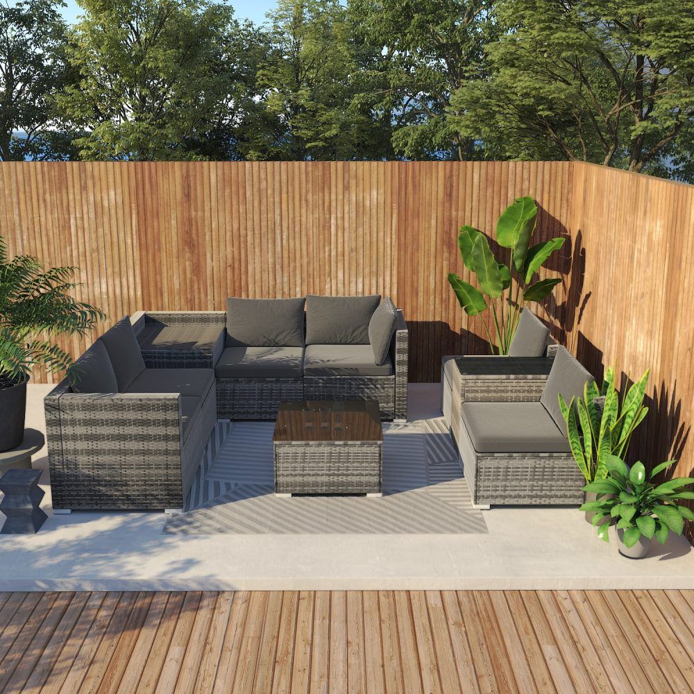 Outdoor patio seating set with gray cushions, woven-style frames, and square ottoman