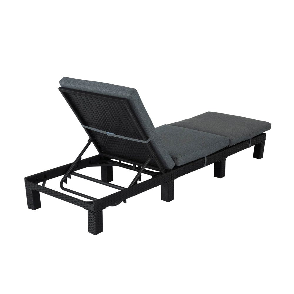 Adjustable rattan sunbed with dark frame, gray cushions, and raised backrest