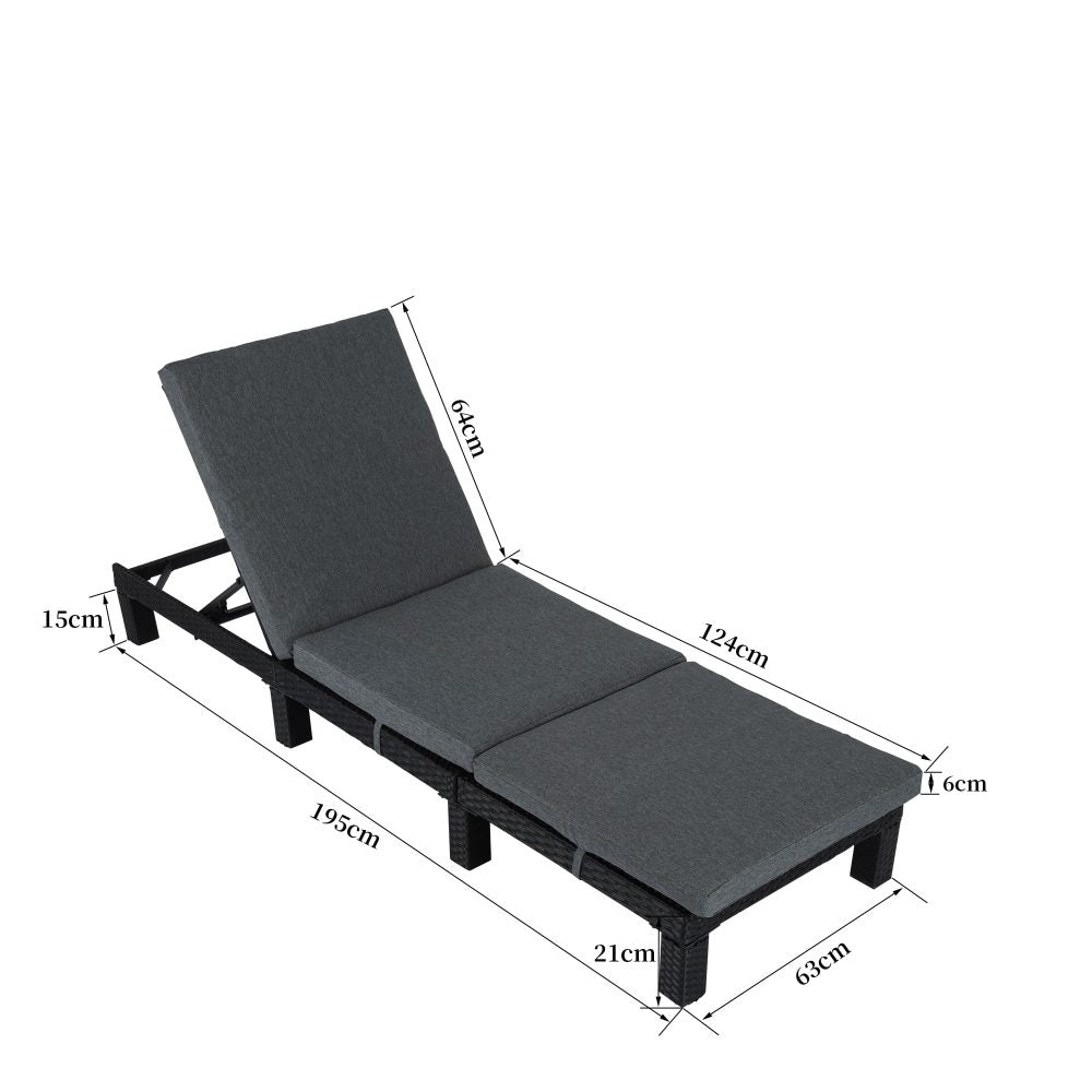 Adjustable rattan sunbed with gray cushions and dark frame, headrest reclined