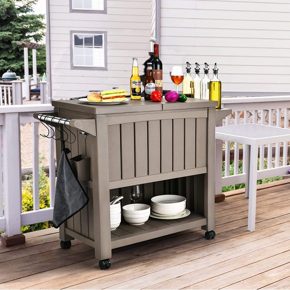 Taupe outdoor bar cart with cooler cabinet, lower storage shelf, and caster wheels