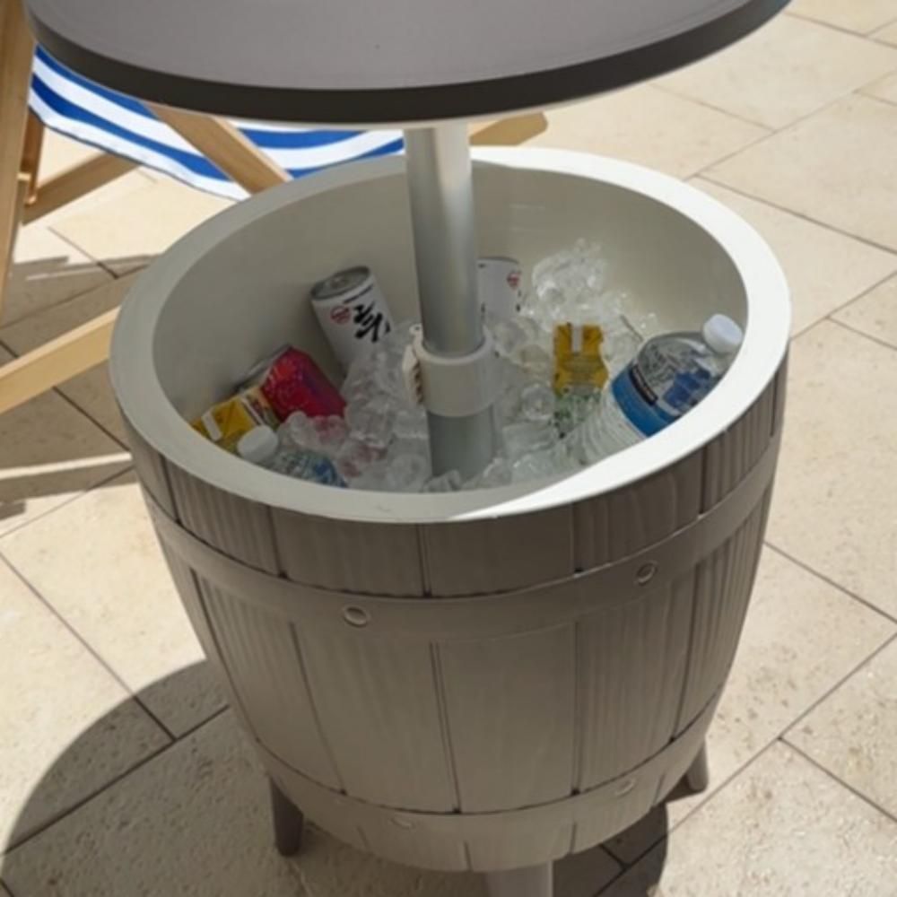 Taupe cooler table with open ice bucket showing bottles surrounded by ice.
