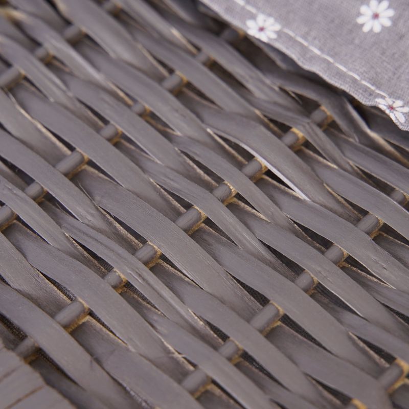 Close-up of grey woven wicker basket texture with crisscross pattern.