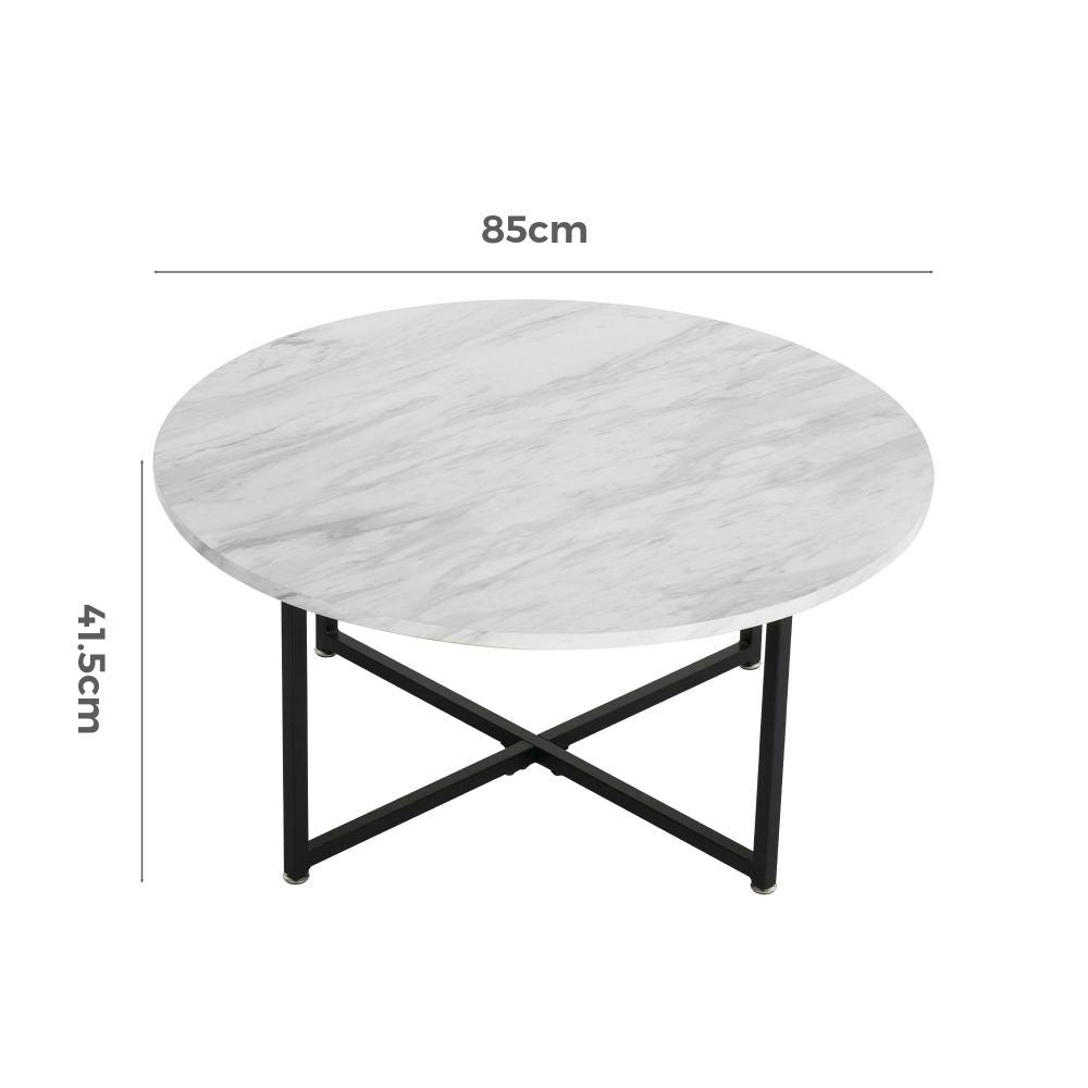 Round coffee table with white marble-effect top and black X-shaped legs