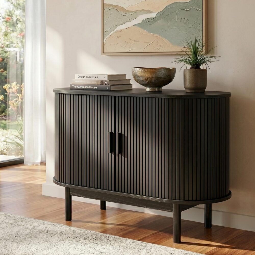 Black ribbed sideboard cabinet with round shape and vertical fluted doors, dark pull handles