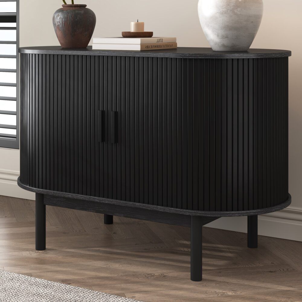 Black ribbed sideboard cabinet front with two vertical doors and central dark bar pull