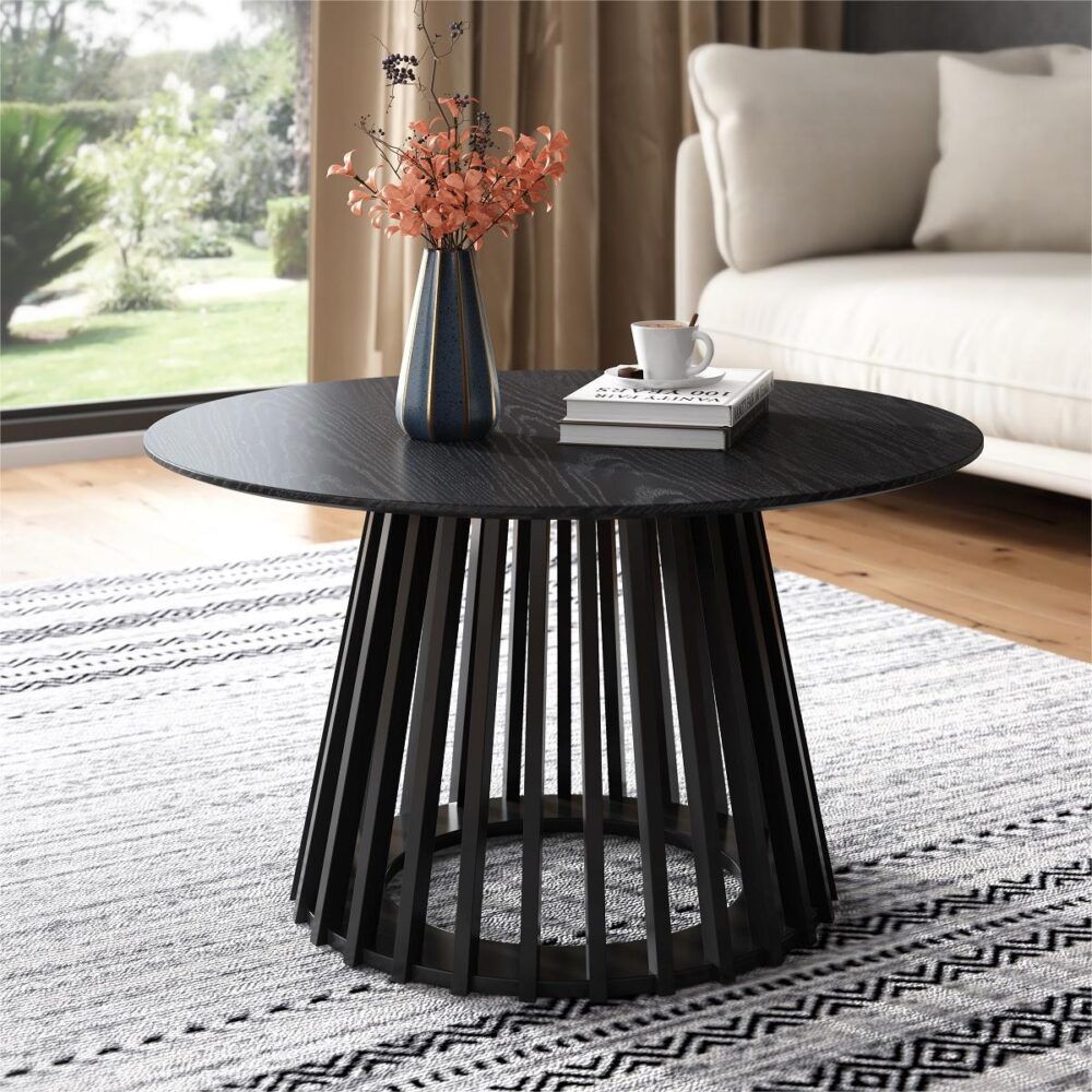 Round dark wood coffee table with slatted pedestal legs and central tabletop.