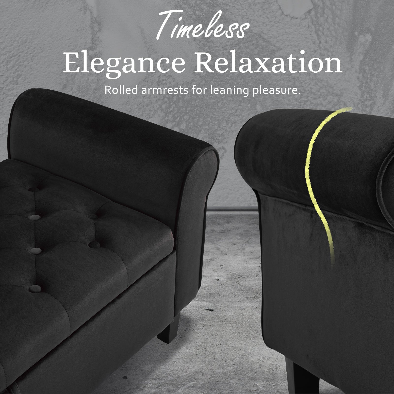 Black velvet ottoman bench with rolled arms and tufted seat cushions, side view.