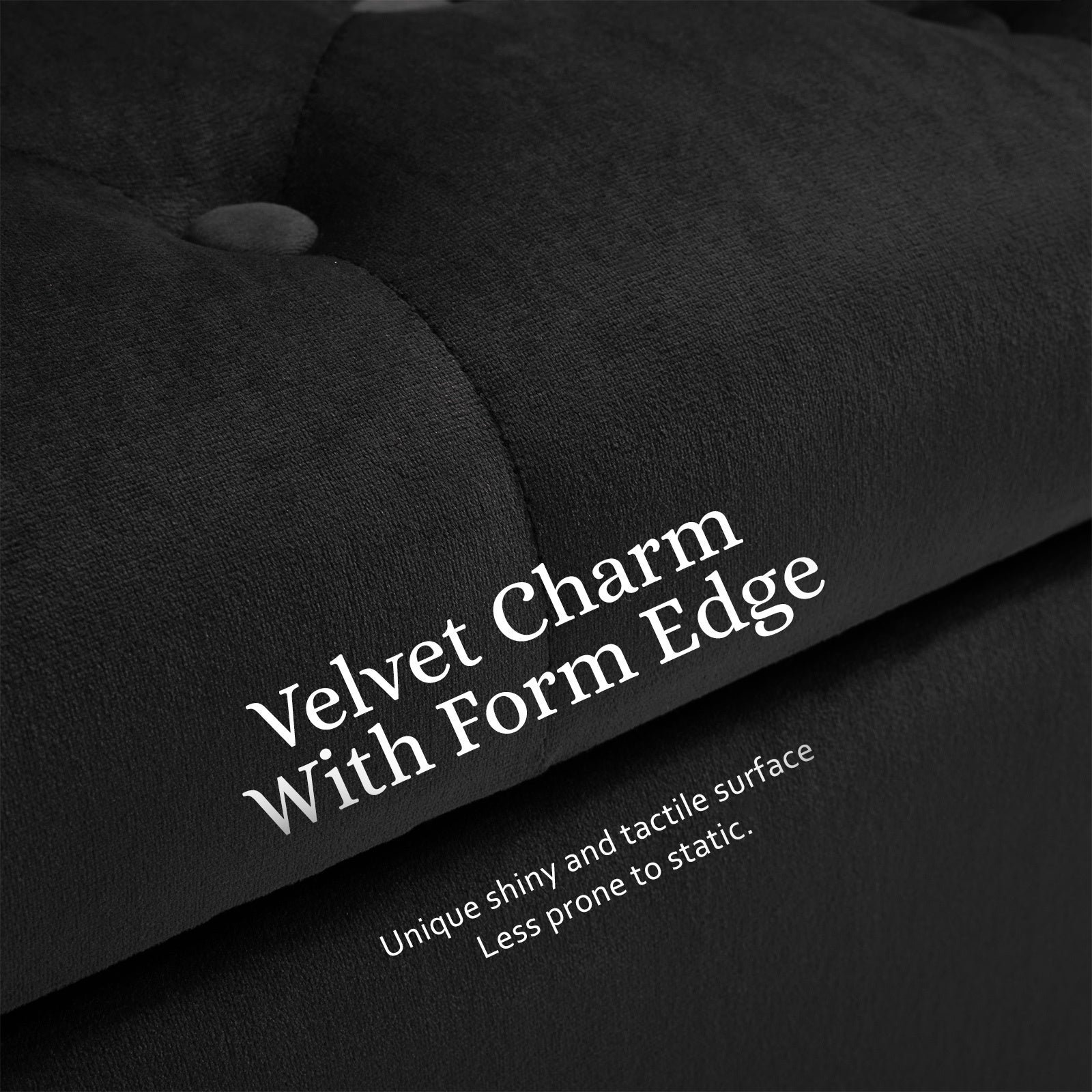 Black velvet ottoman bench with curved arm and plush upholstery edge detail.