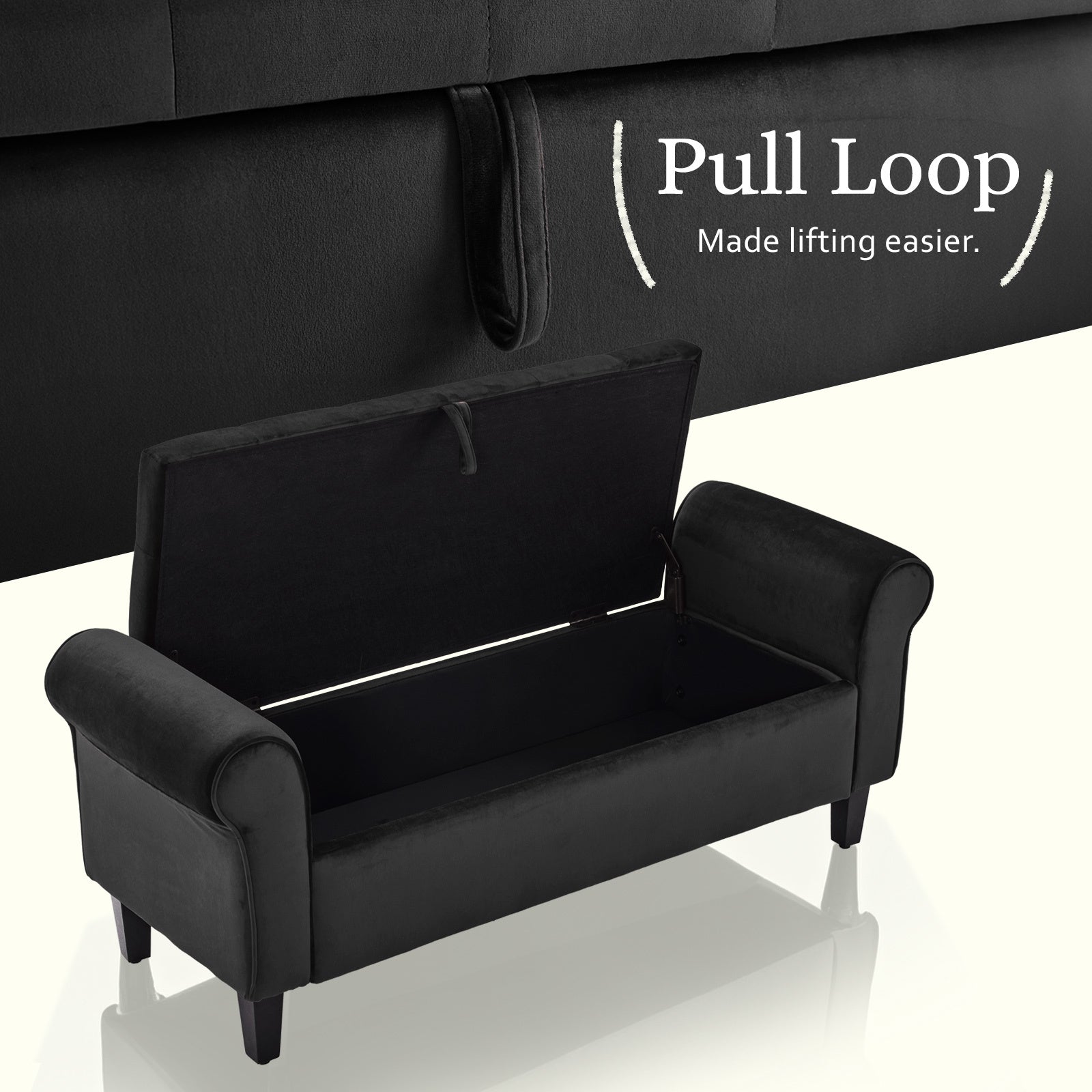 Black velvet storage ottoman bench with hinged lid open and pull loop on side.