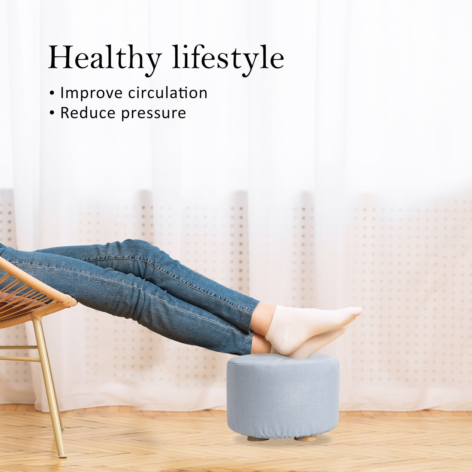 Light blue round fabric ottoman foot stool with padded seat