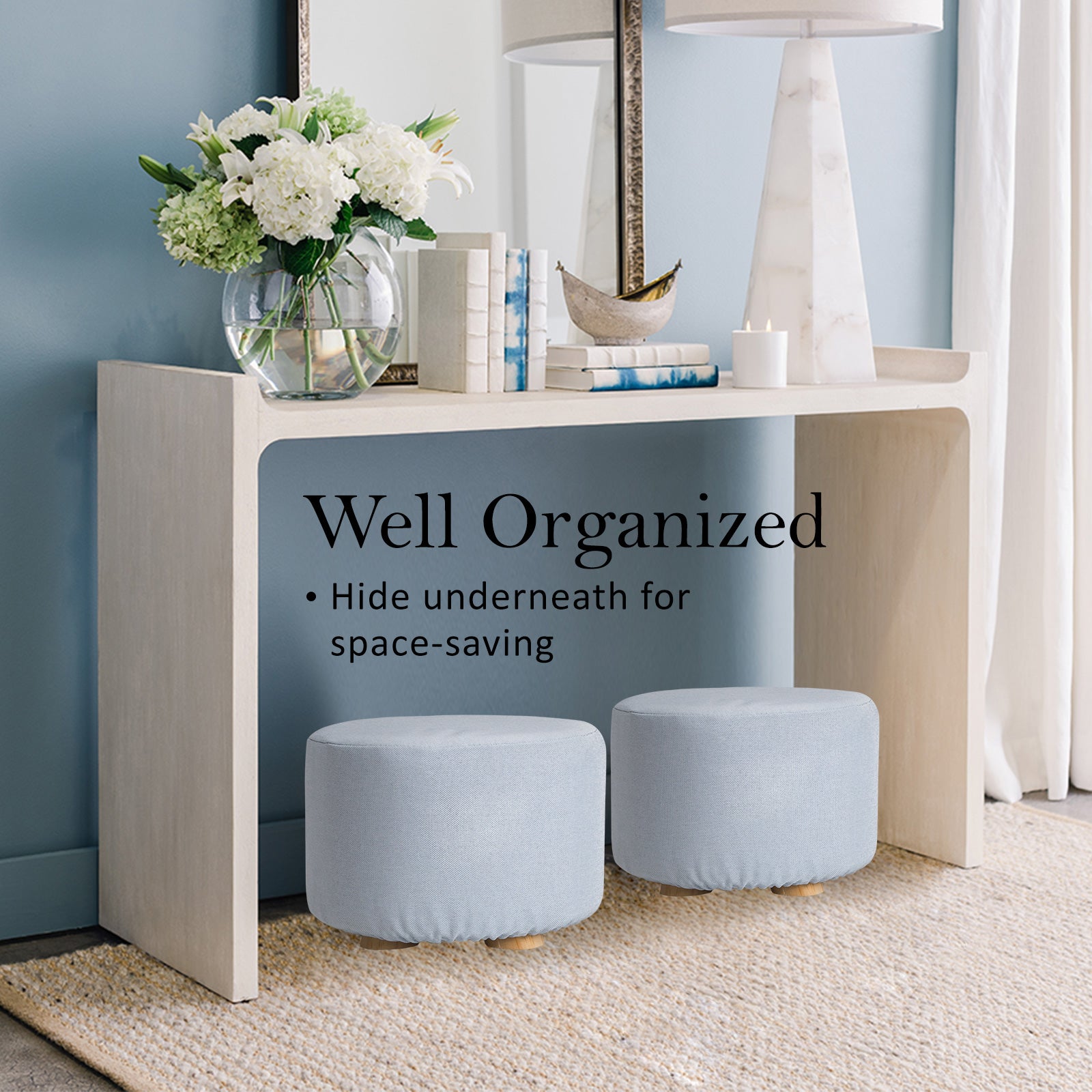 Light blue round fabric ottoman foot stool with padded seat