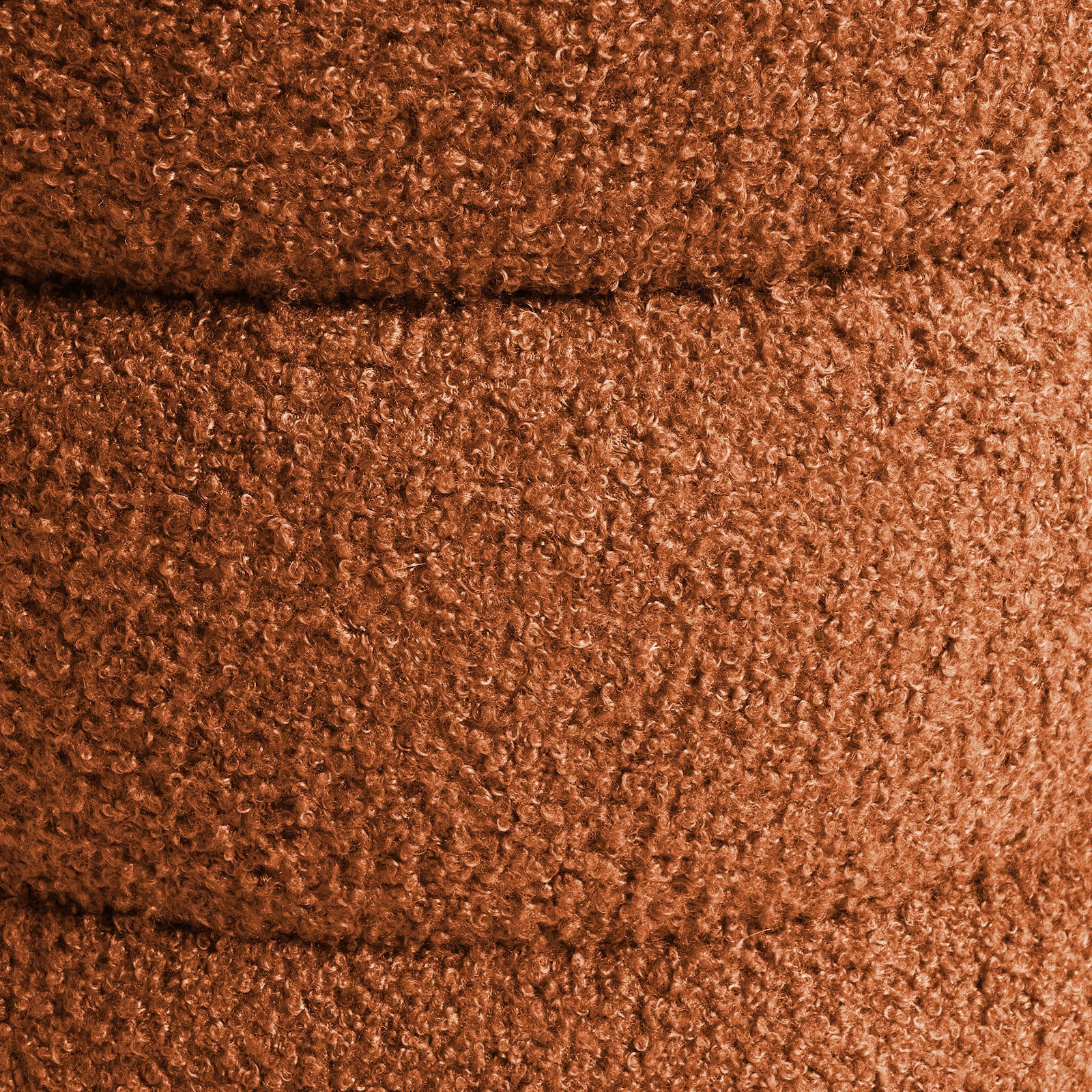 Orange teddy fleece ottoman cover close-up with dense curly texture