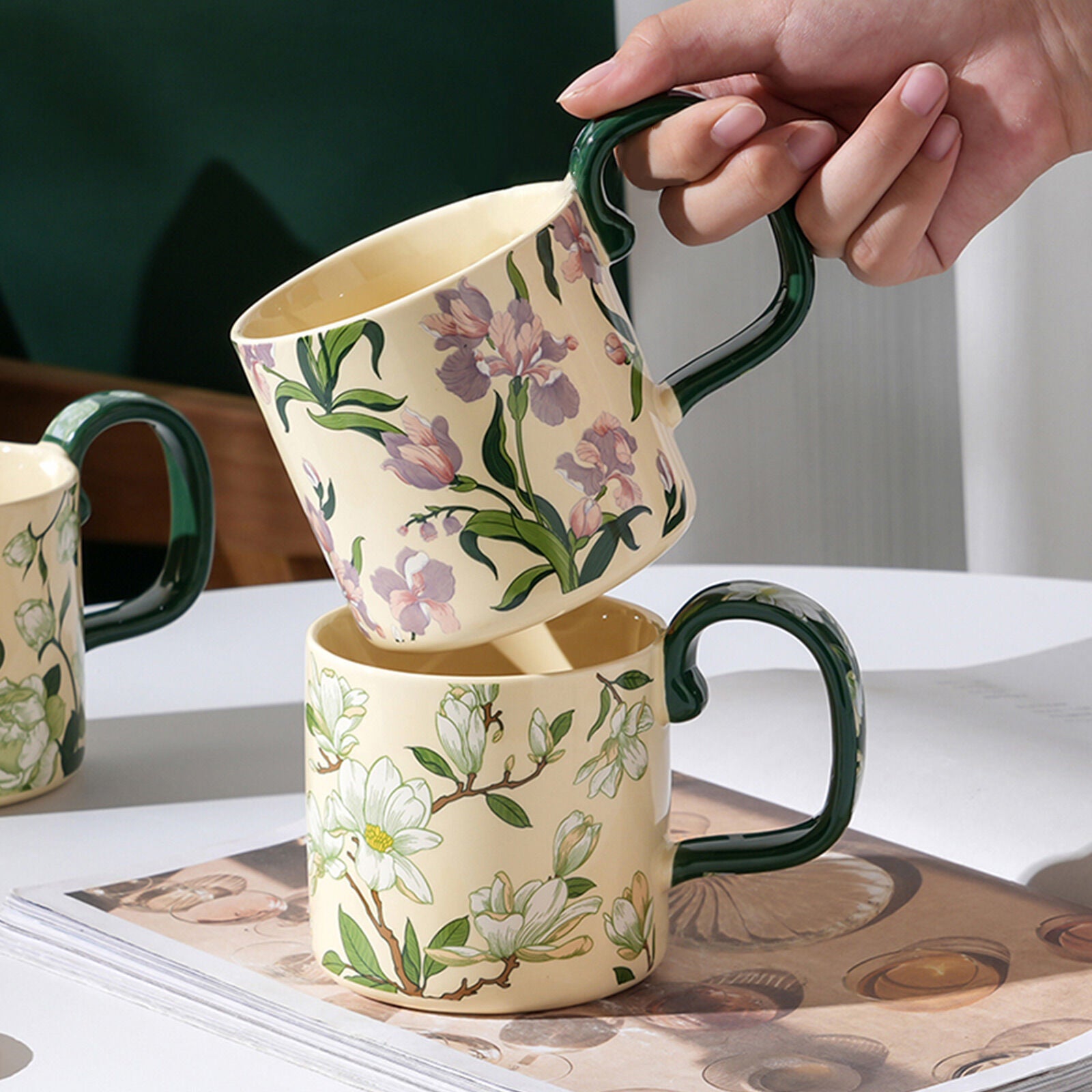 Ceramic porcelain mug set: two cream mugs with green handles and floral prints