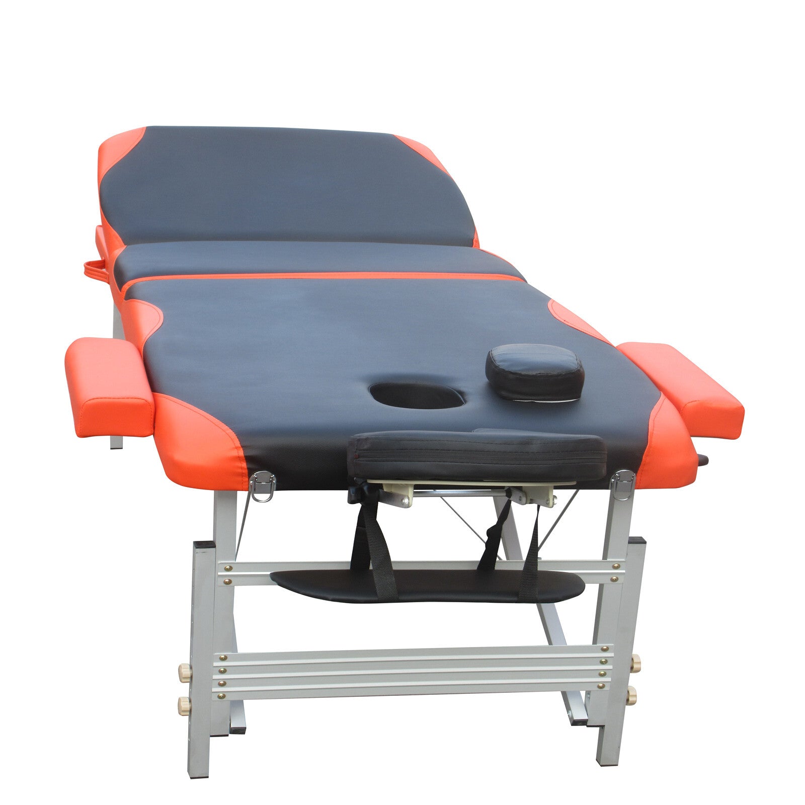 Portable massage table with black cushions, orange sides, and face opening