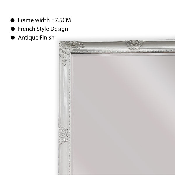 White ornate mirror with textured antique finish and carved French-style border