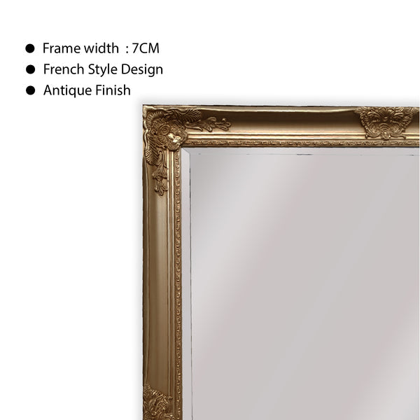 Close-up of ornate mirror frame edge with antique-style carved detailing