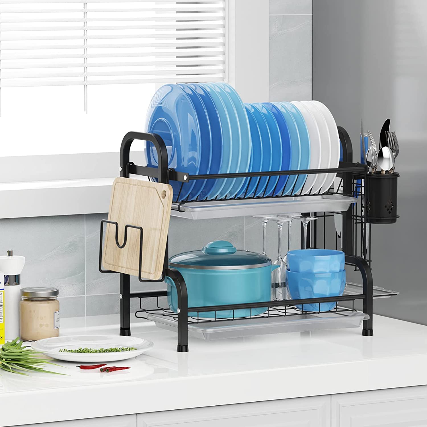 Two-tier dish rack with stacked blue plates and cookware, black frame and side holder