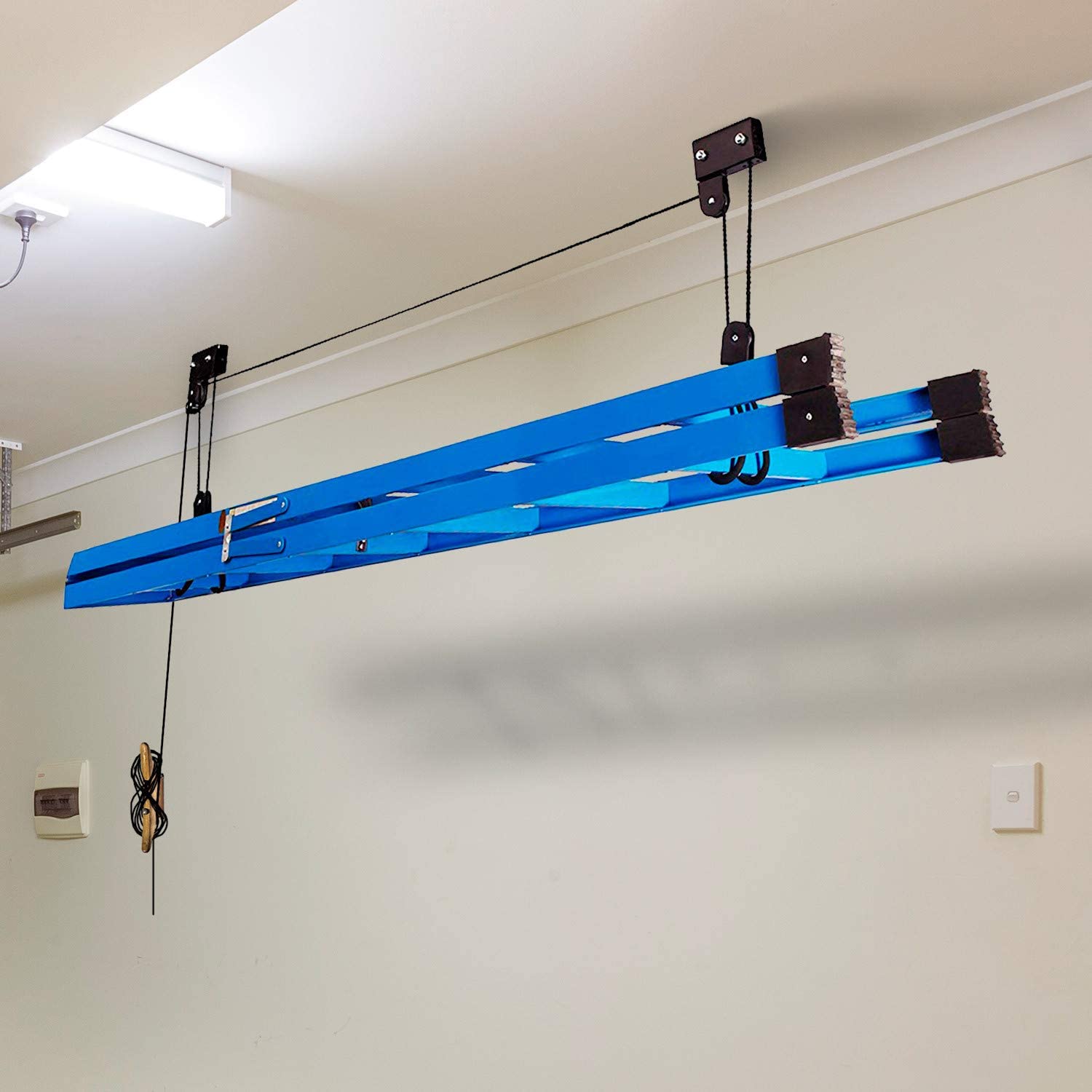 Blue ceiling bike hoist bar with hanging straps, hooks, and pulleys for lifting bicycles