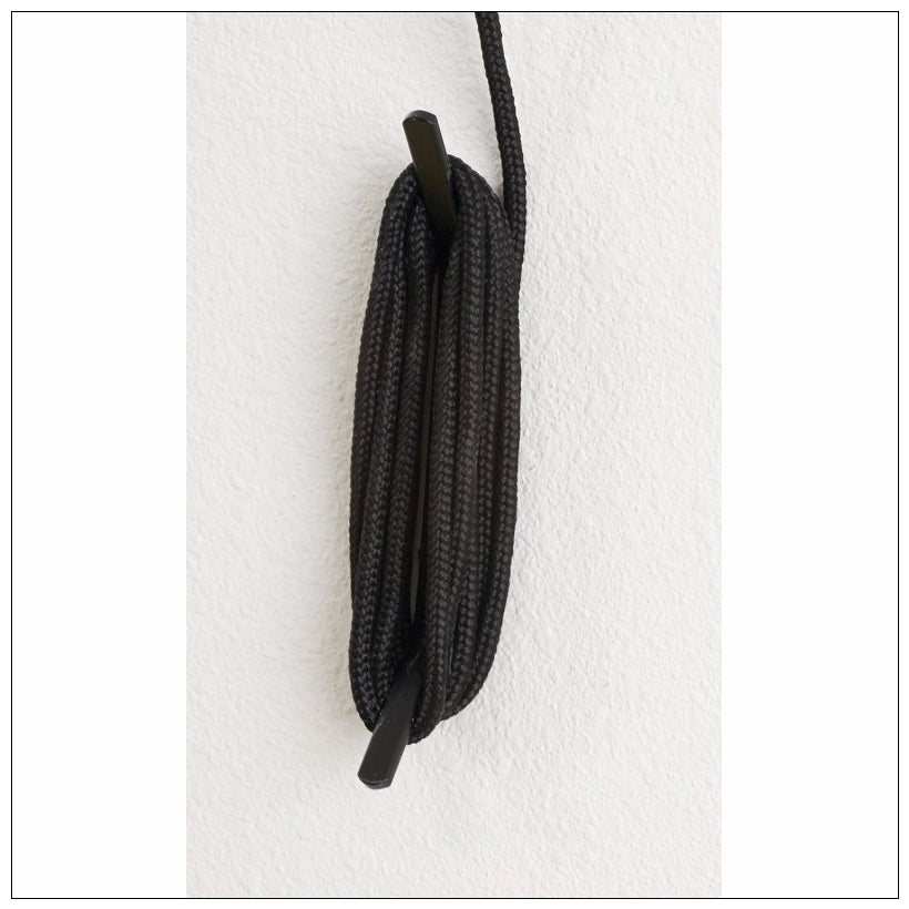 Close-up of black braided hoist rope bundle with metal end piece