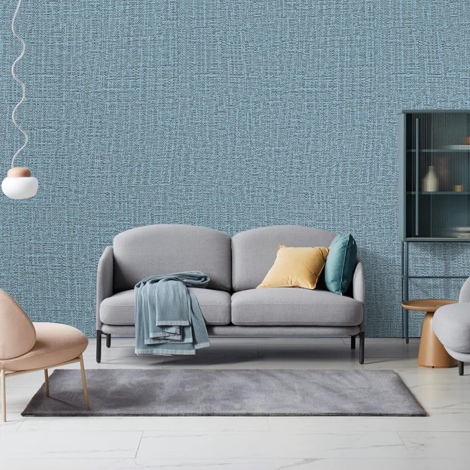 Blue woven-texture wallpaper wall with sofa seating