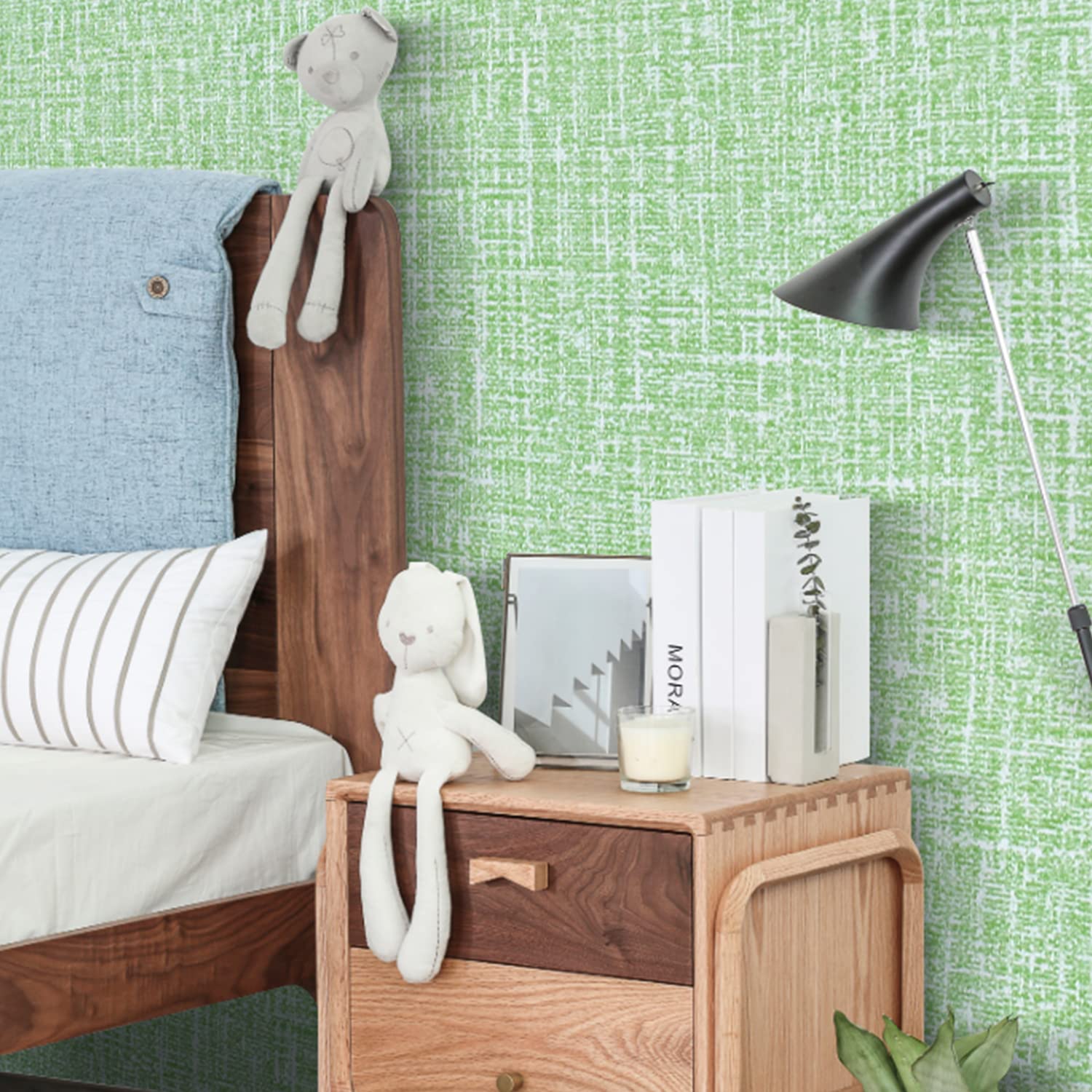 Green textured wallpaper applied to wall with repeating grid weave pattern