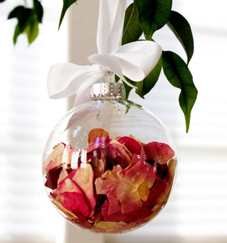 Clear glass bauble with silver cap, filled with red rose petals and ribbon