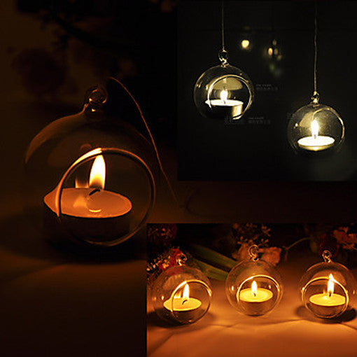 Clear glass hanging ball tealight candle holder set with lit tea lights