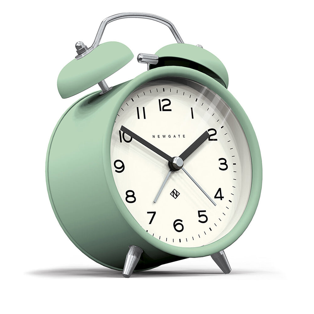 Mint green alarm clock with cream face, twin bells, and metal feet