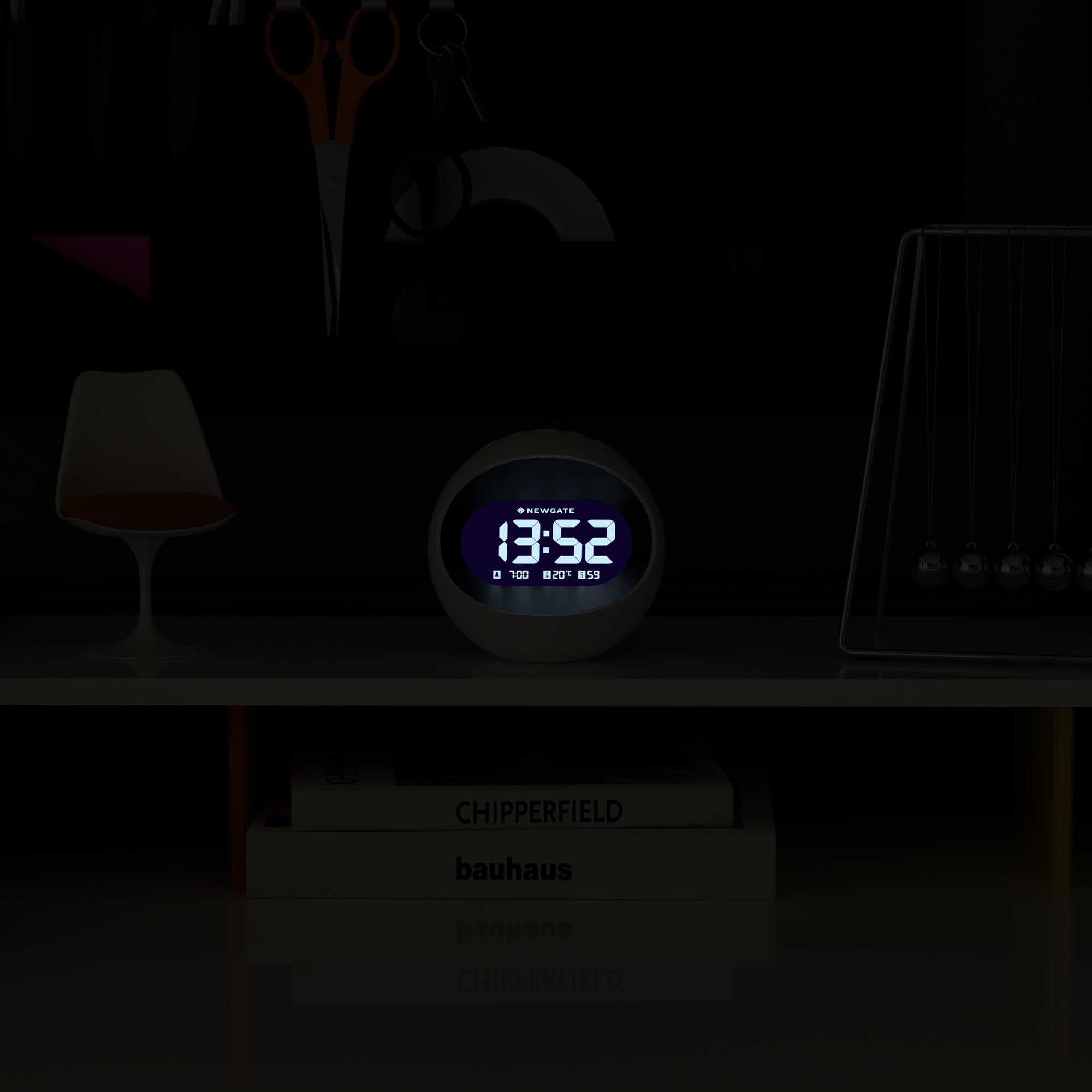 White round LCD alarm clock with blue backlit time display showing 13:52